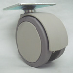 Ruedas - Con placa giratoria de acero, rueda doble de elastómero, serie NA100 (Color beige).
